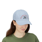 Woman wearing a light blue embroidered classic dad cap hat with a Gymnastics text and graphic 