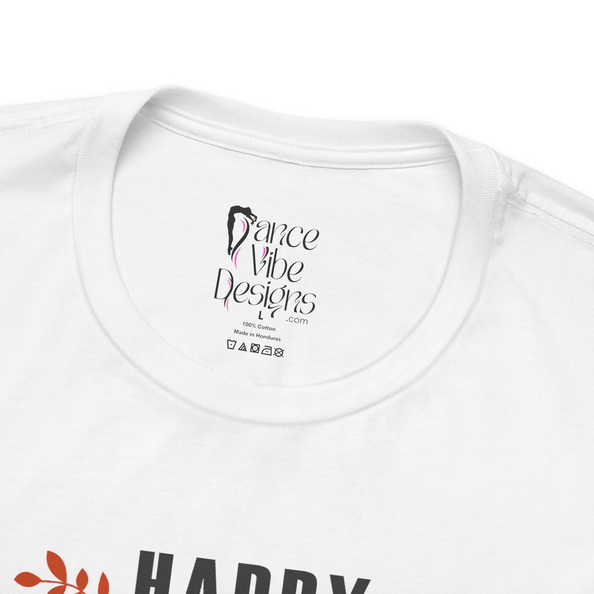 Close-up of a white crewneck t-shirt showing the inner neck label with Dance Vibe Designs LLC printed in black.