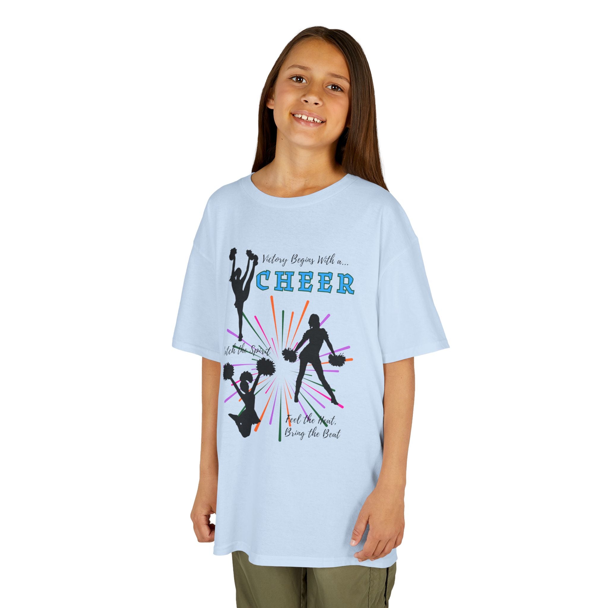 Young girl wearing a youth Gildan 5000B heavy cotton t-shirt in light blue with a Cheer Team design