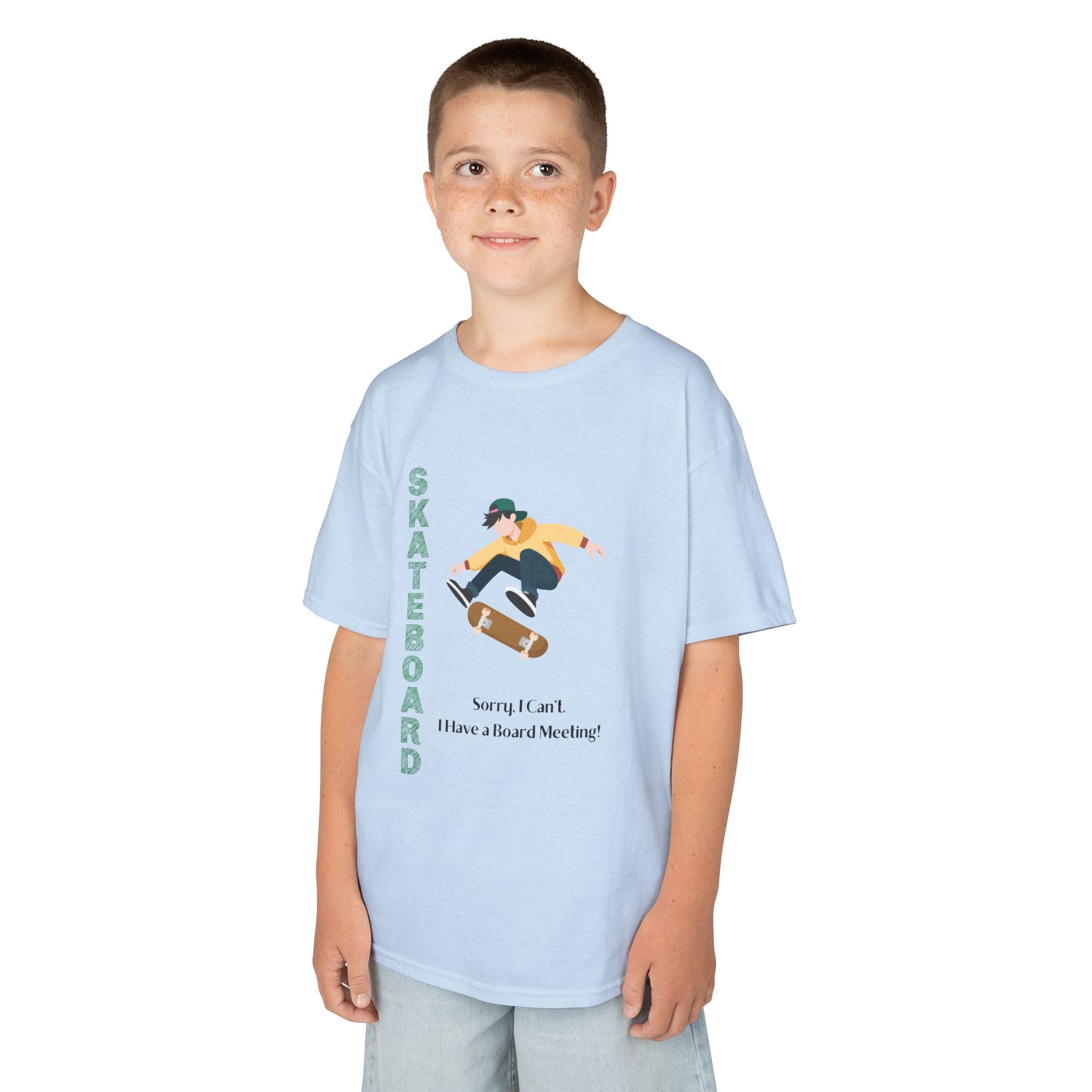 Young boy wearing a youth Gildan 5000B heavy cotton t-shirt in light blue featuring a boy Skateboarding