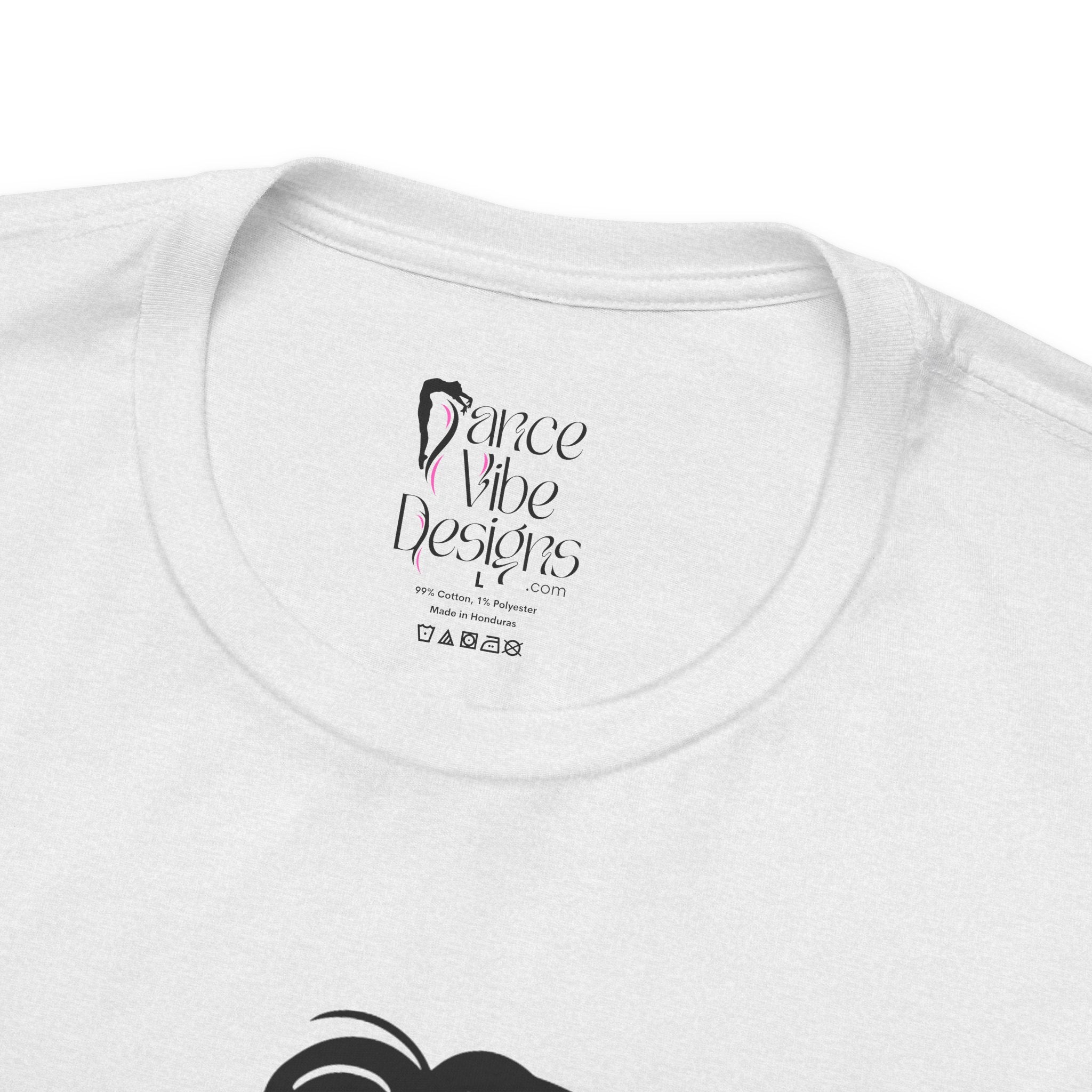Close-up of a t-shirt's inner neck label with the brand Dance Vibe Designs showing above the care instructions.
