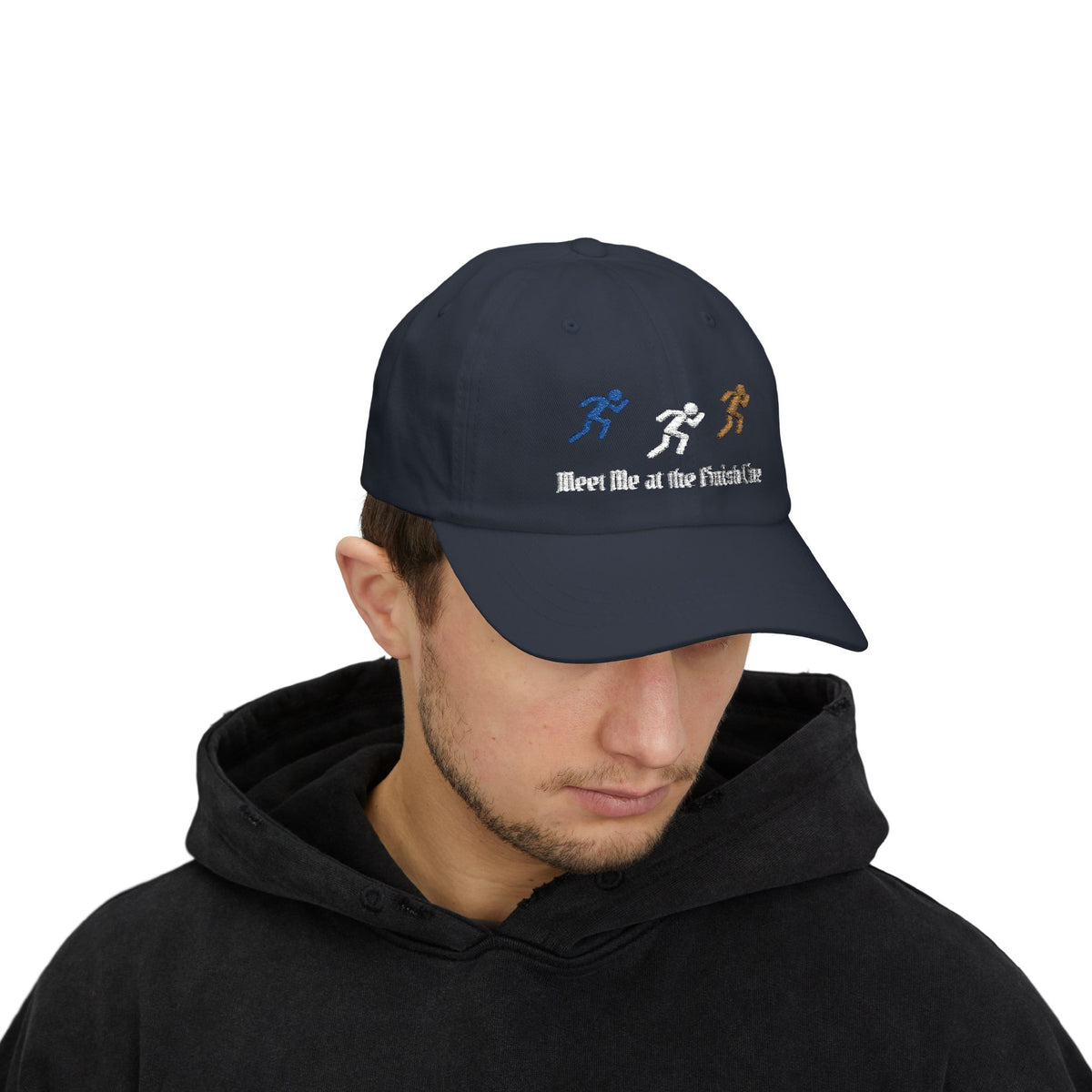 Man wearing a navy embroidered classic dad cap hat with a Meet Me at the Finish Line text and graphic 