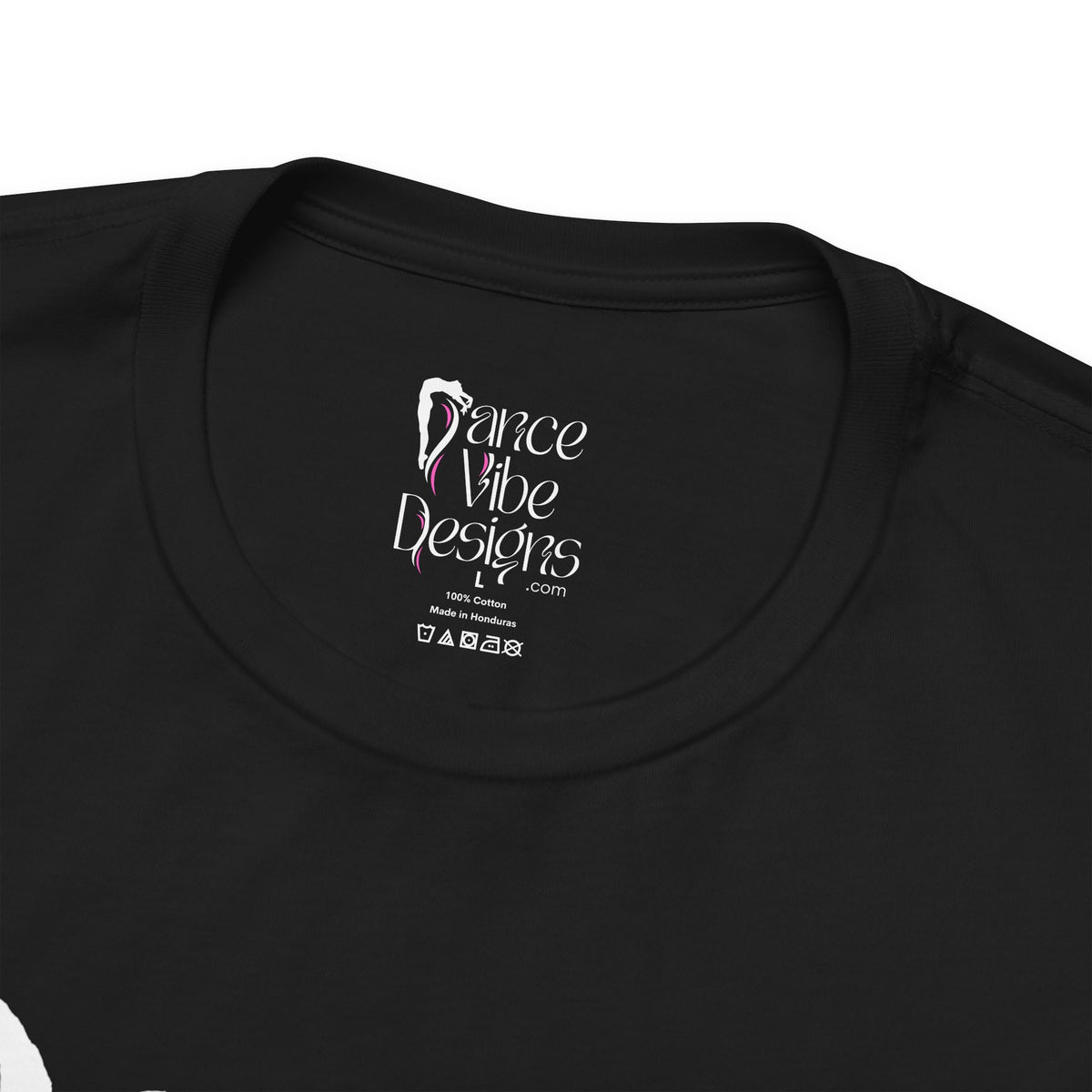 Close-up of a crewneck t-shirt showing the inner neck label with the Dance Vibe Designs logo above the care instructions.