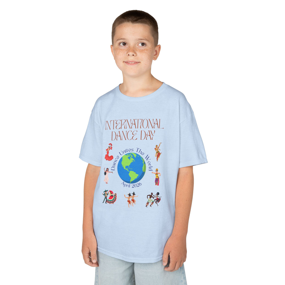 Young boy wearing a youth Gildan 5000B heavy cotton t-shirt in light blue with an International Dance Day theme 