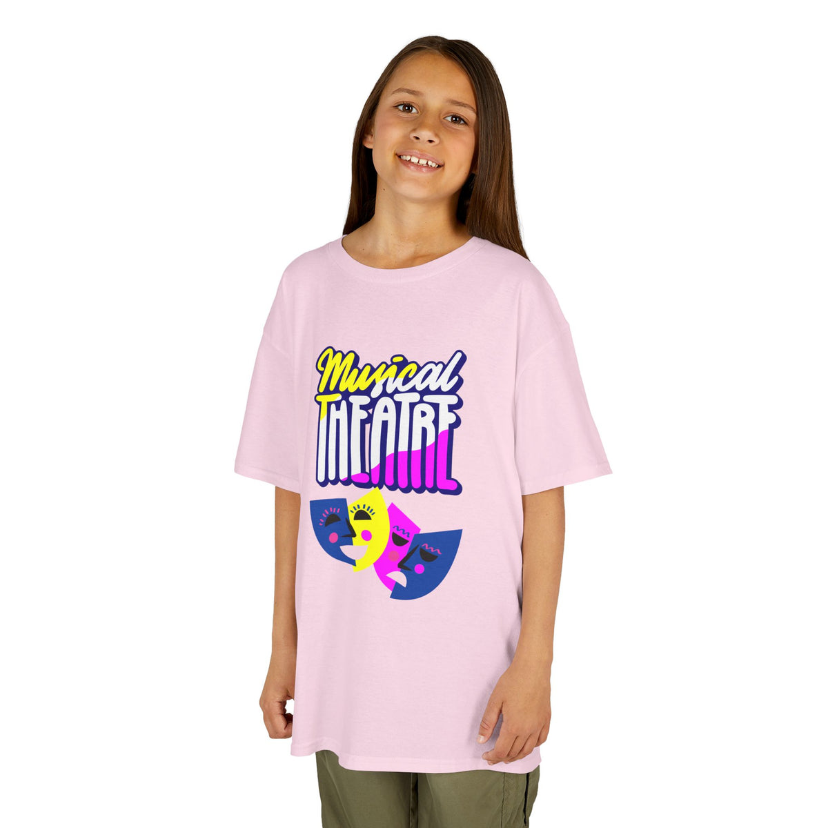 Young girl wearing a youth Gildan 5000B heavy cotton t-shirt in light pink with a Musical Theater rainbow mask graphic