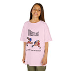 Young girl wearing a youth Gildan 5000B heavy cotton t-shirt in light pink with a Wrestling text and graphic