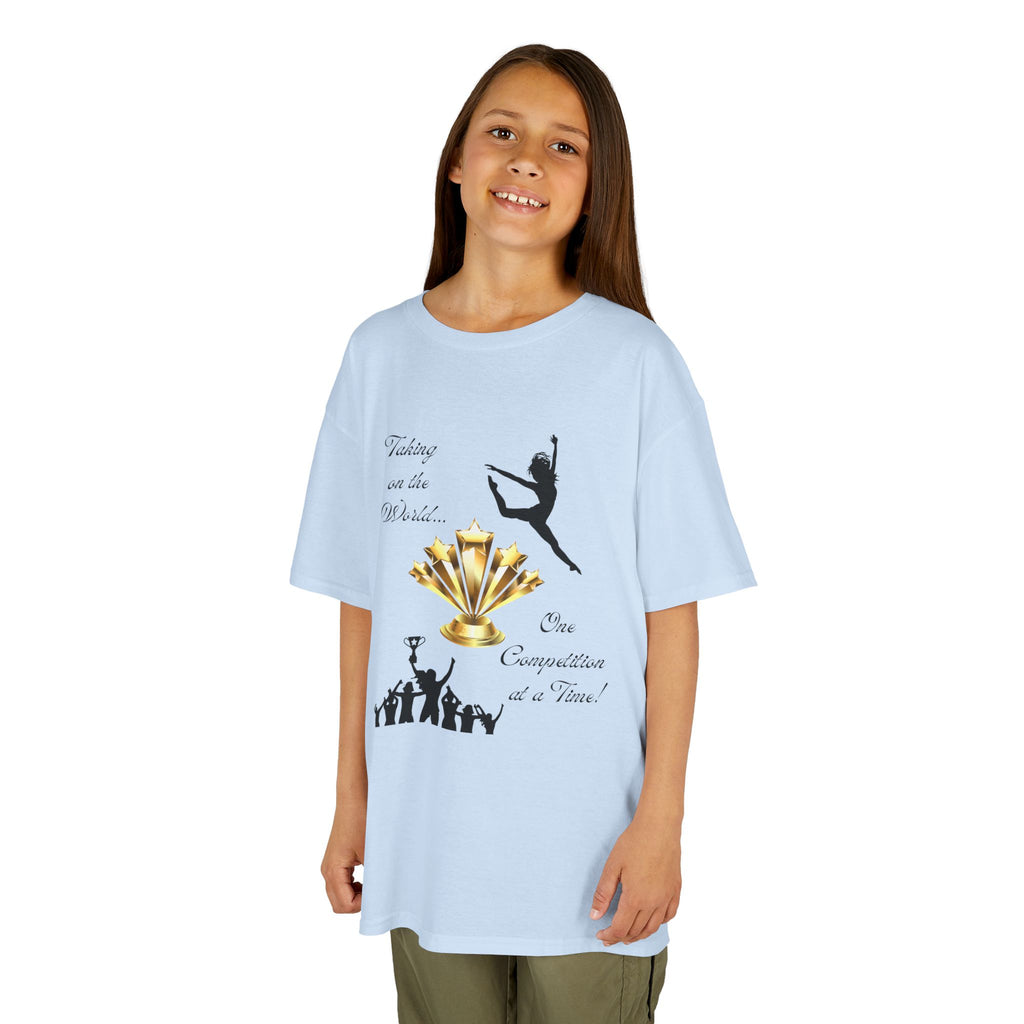 Young girl wearing a youth Gildan 5000B heavy cotton t-shirt in light blue with a Dance Competition theme