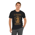 Man wearing a black graphic T-shirt with a gold chess knight design and the words A PROUD KNIGHT on the front.