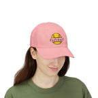 Woman wearing a pink embroidered classic dad cap hat with a Softball text and graphic
