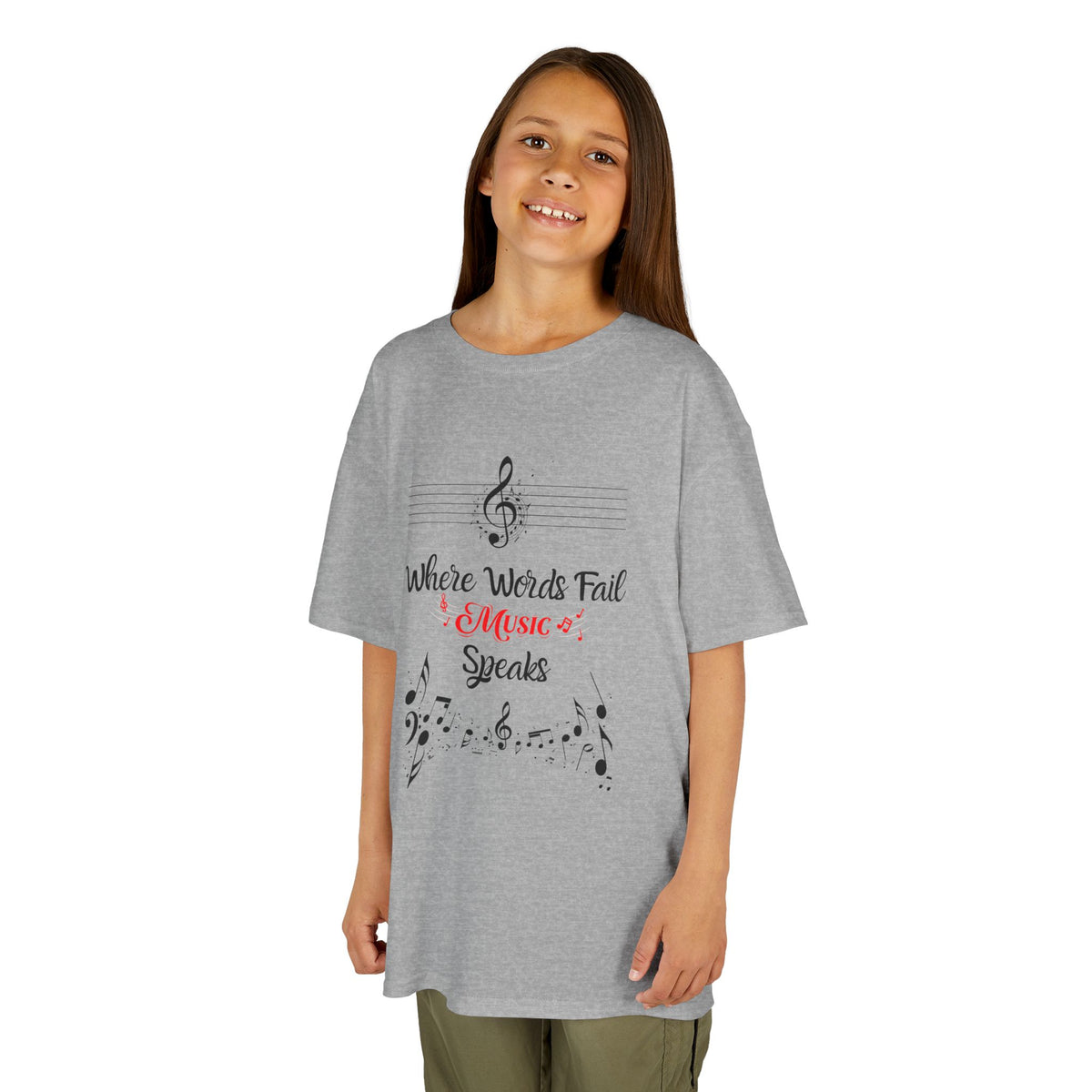 Young girl wearing a youth Gildan 5000B heavy cotton t-shirt in sport grey with a Where Words Fail Music Speaks text and graphic