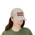 Woman wearing a stone embroidered classic dad cap hat with Basketball text and graphic