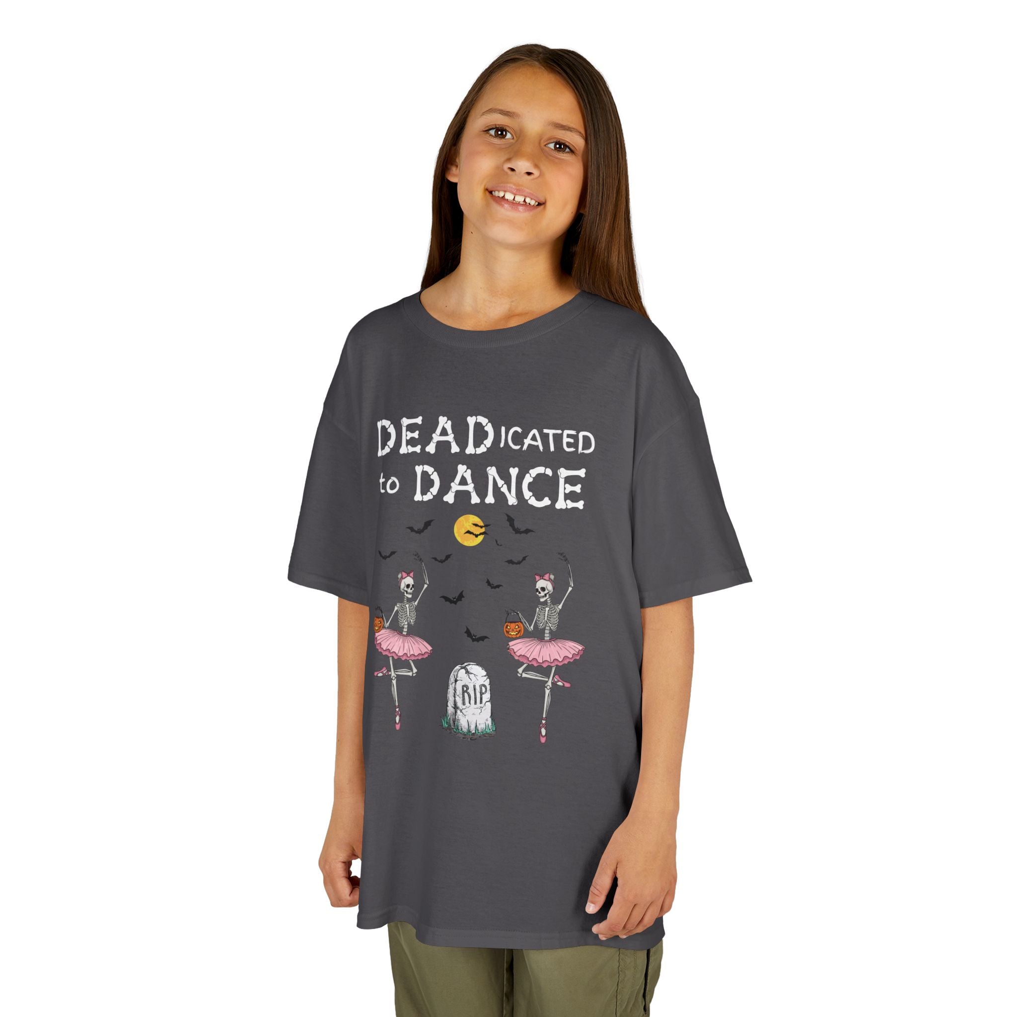 Young girl wearing a youth Gildan 5000B heavy cotton t-shirt in charcoal with a Deadicated to Dance Halloween theme