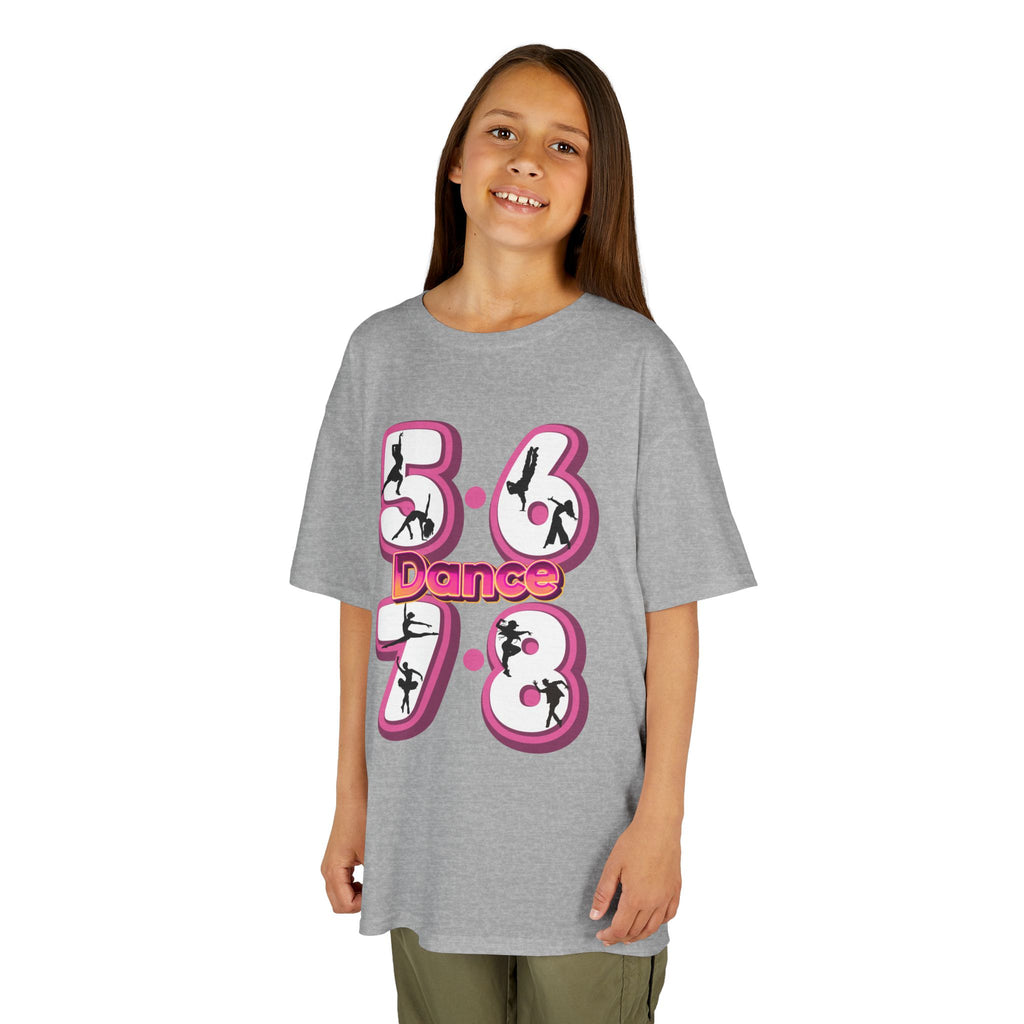 Young girl wearing a Gildan 5000B heavy cotton t-shirt in sport grey with a 5678 Dance text and graphic