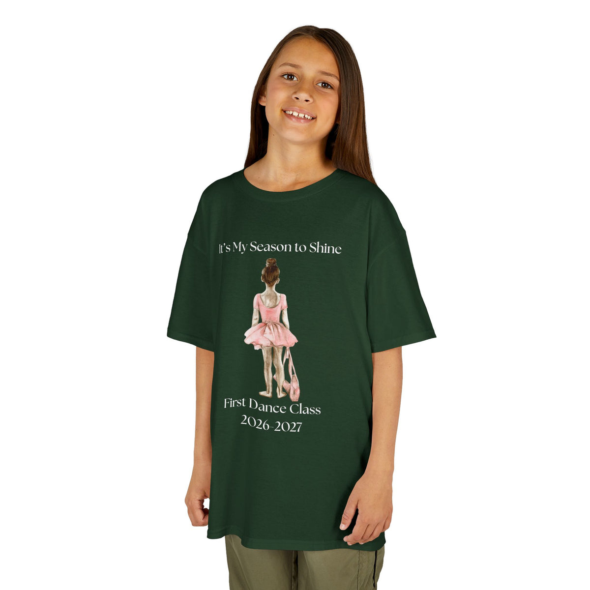 Young girl wearing a youth Gildan 5000B heavy cotton t-shirt in forest green with a First Dance Class theme
