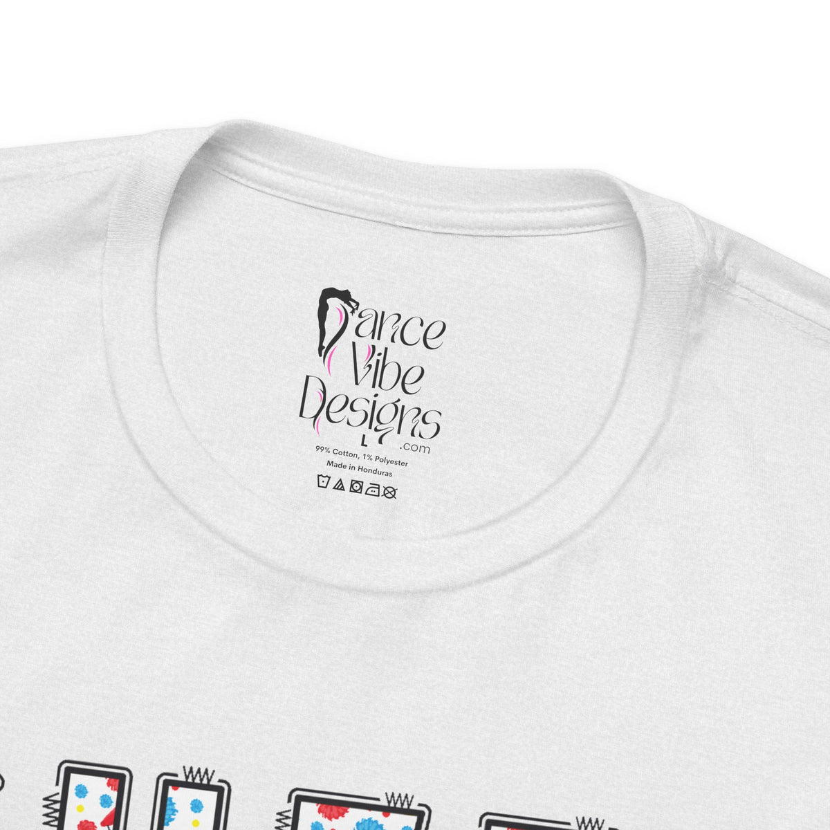 Close-up of a t-shirt's inner neck label with the brand Dance Vibe Designs printed above the care instructions.