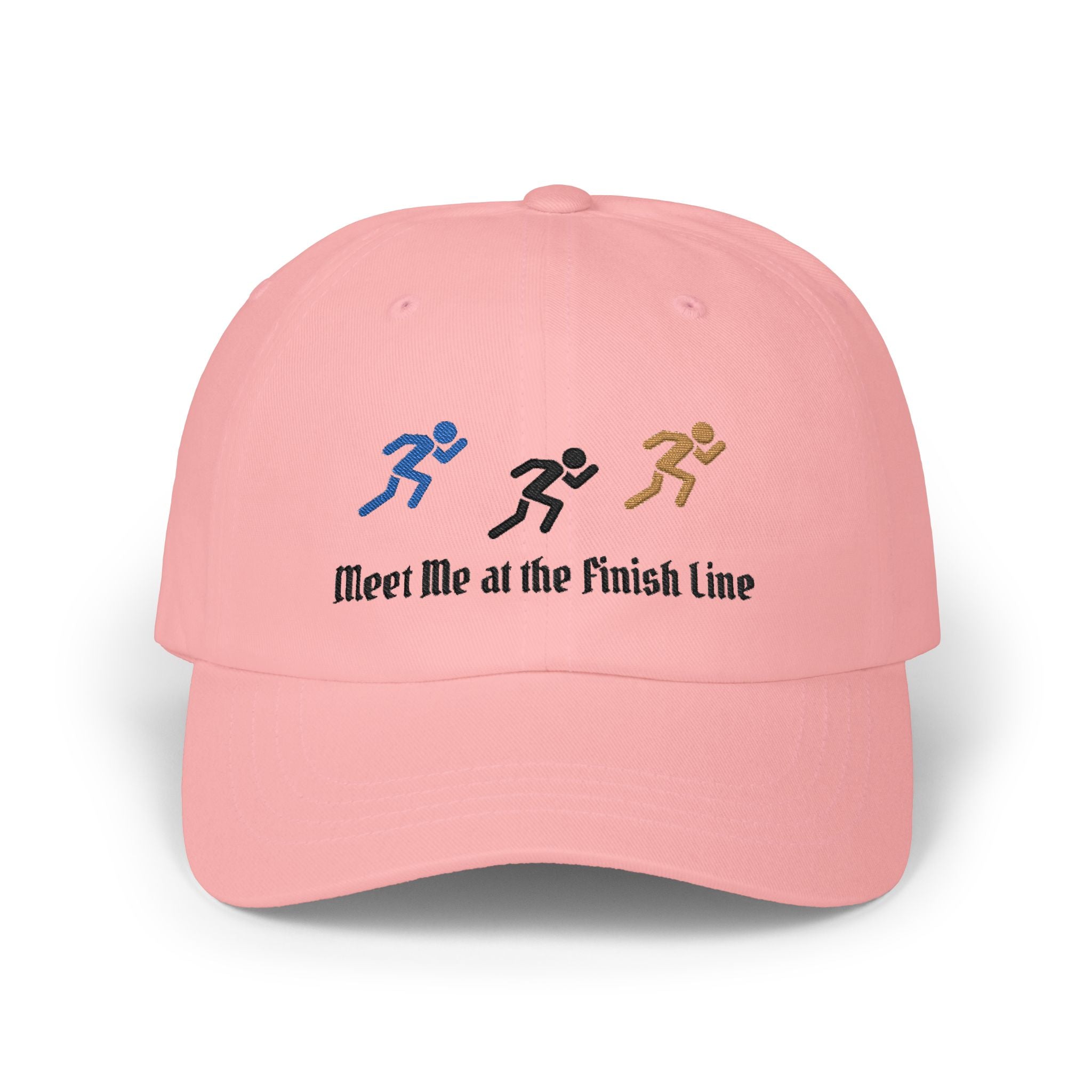 A pink baseball cap featuring embroidered running figures in blue, black, and tan above the text Meet Me at the Finish Line.