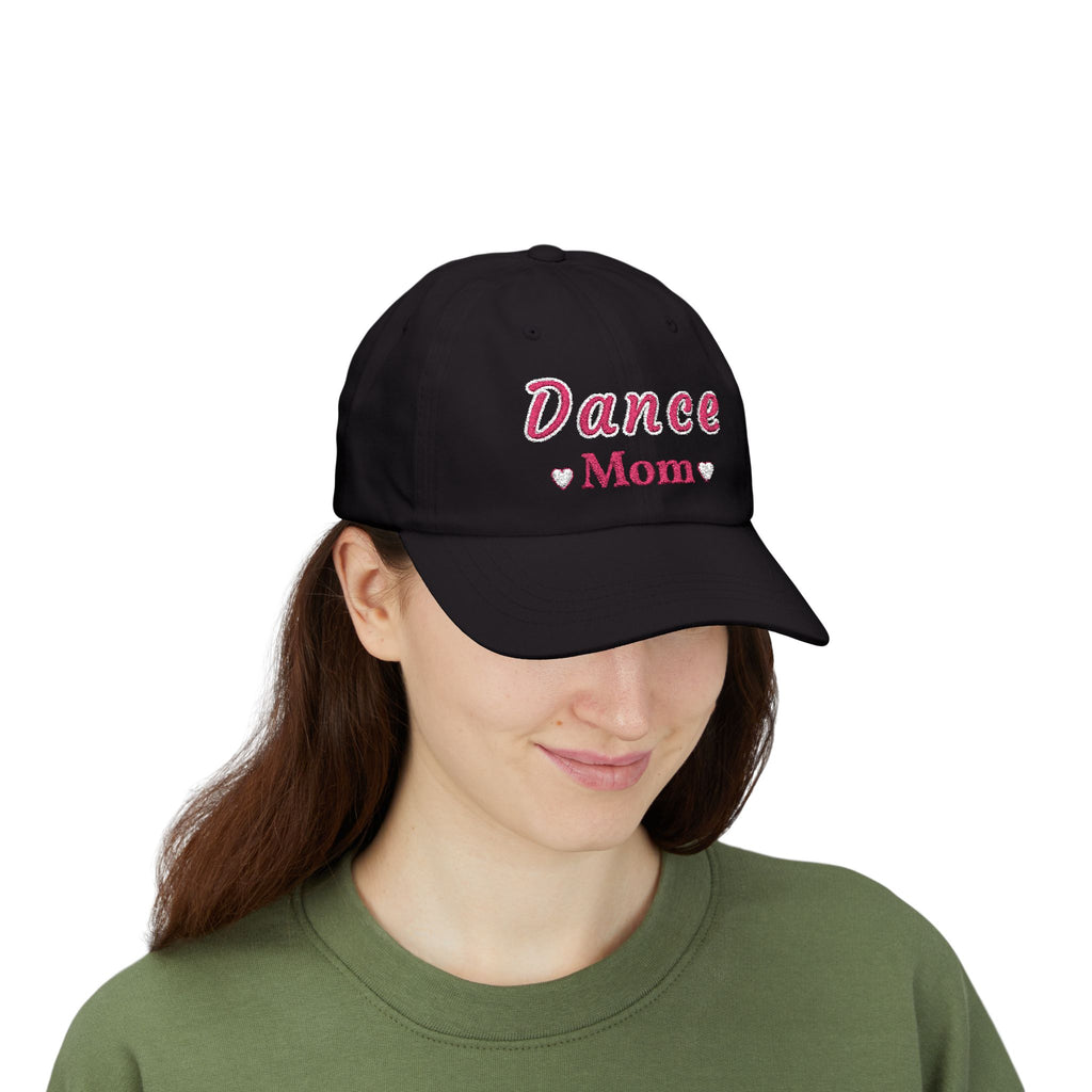 Woman wearing a black embroidered classic dad cap hat with a Dance Mom text and graphic