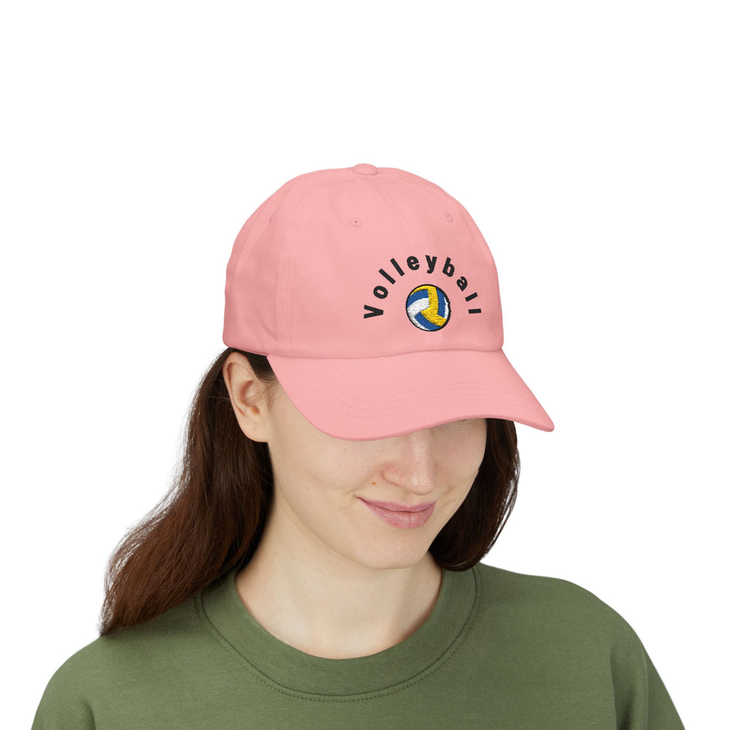 Woman wearing a pink embroidered classic dad cap hat with a Volleyball text and graphic