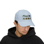 Man wearing a light blue embroidered classic dad cap hat with a Play Tennis text and graphic