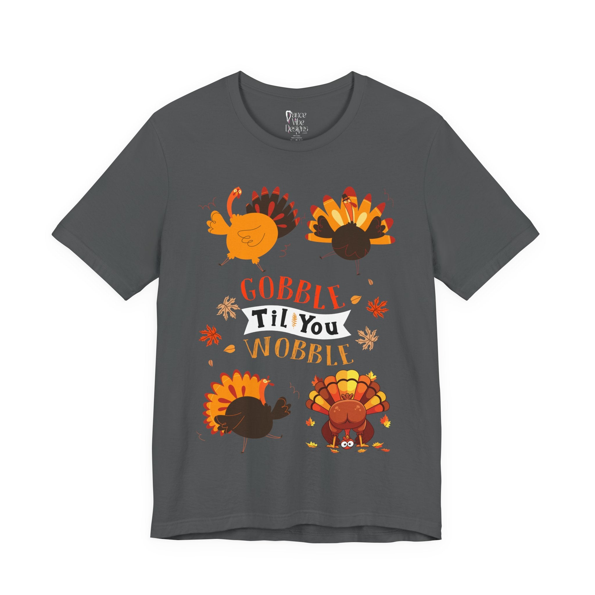 An asphalt short-sleeve t-shirt with a colorful Thanksgiving graphic featuring cartoon turkeys and the text GOBBLE TIL YOU WOBBLE.