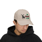 Man wearing a stone cap with an embroidered deer silhouette and The Hunt Is On text.