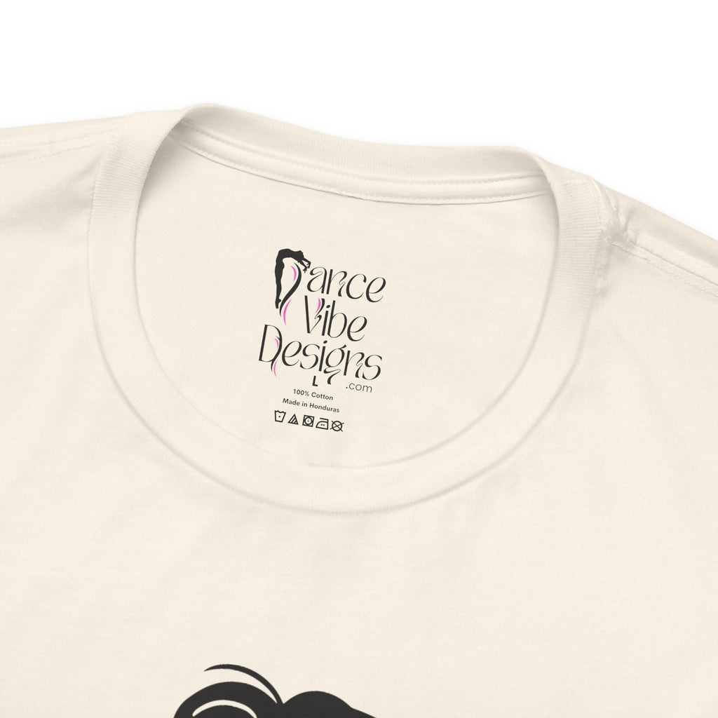 Close-up of a t-shirt's inner neck label with the brand Dance Vibe Designs showing above the care instructions.
