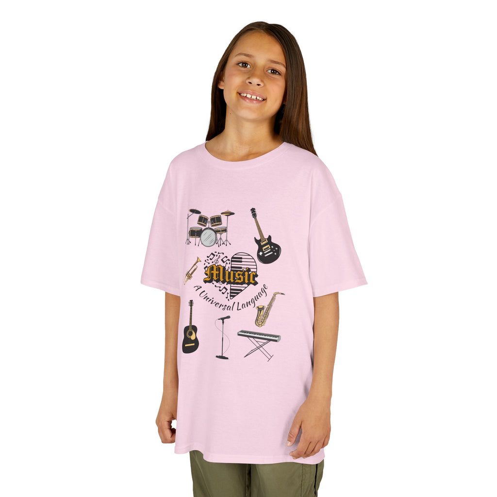 Young girl wearing a youth Gildan 5000B heavy cotton t-shirt in light pink with a Music A Universal Language theme