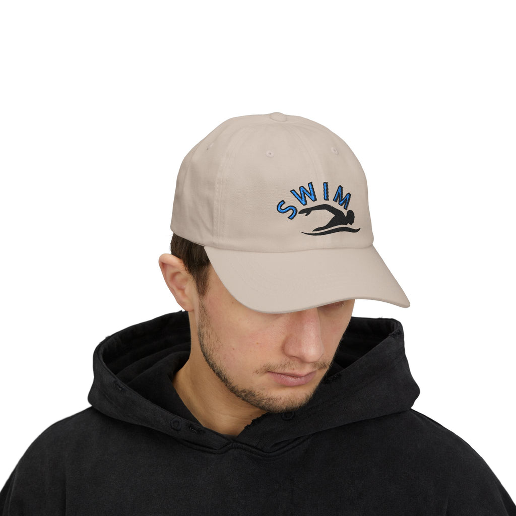 Man wearing a stone embroidered classic dad cap hat with a Swim text and graphic