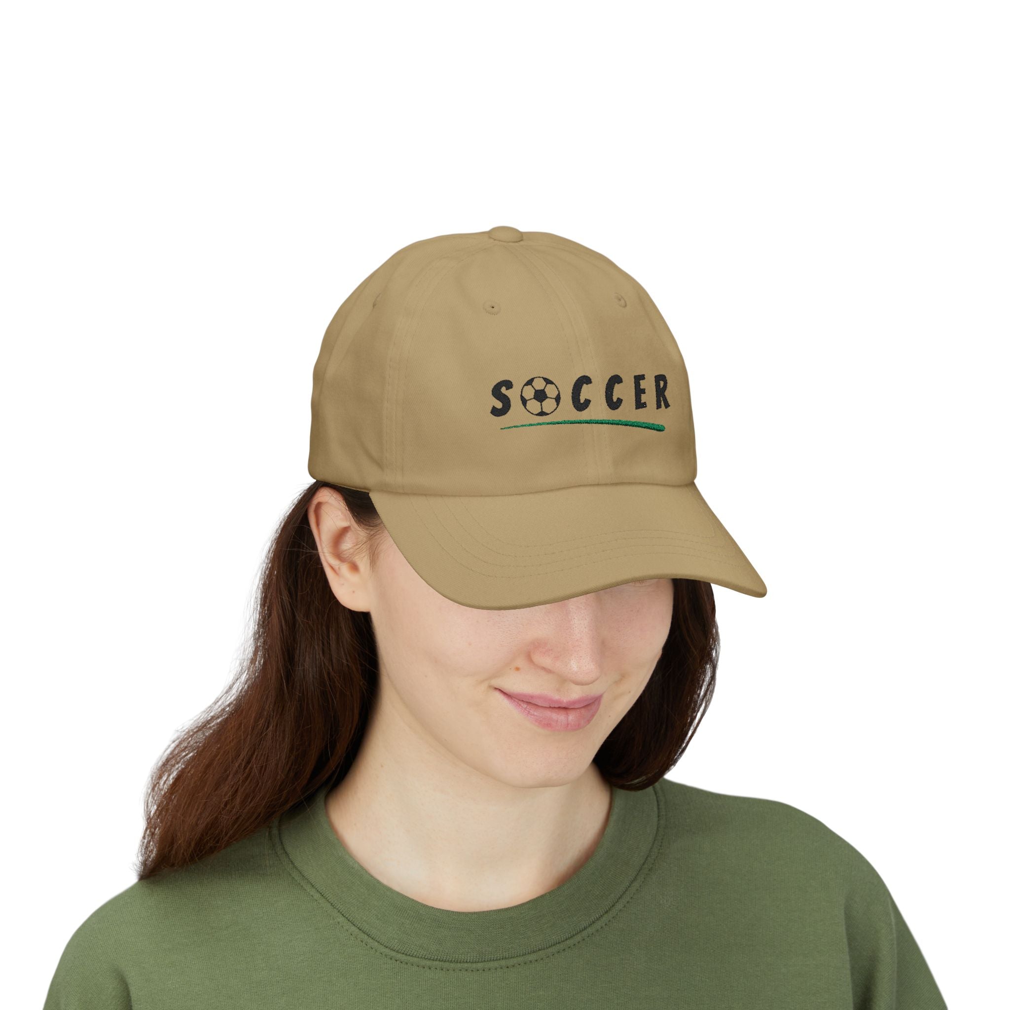 Woman wearing a khaki embroidered classic dad cap hat with Soccer text and graphic