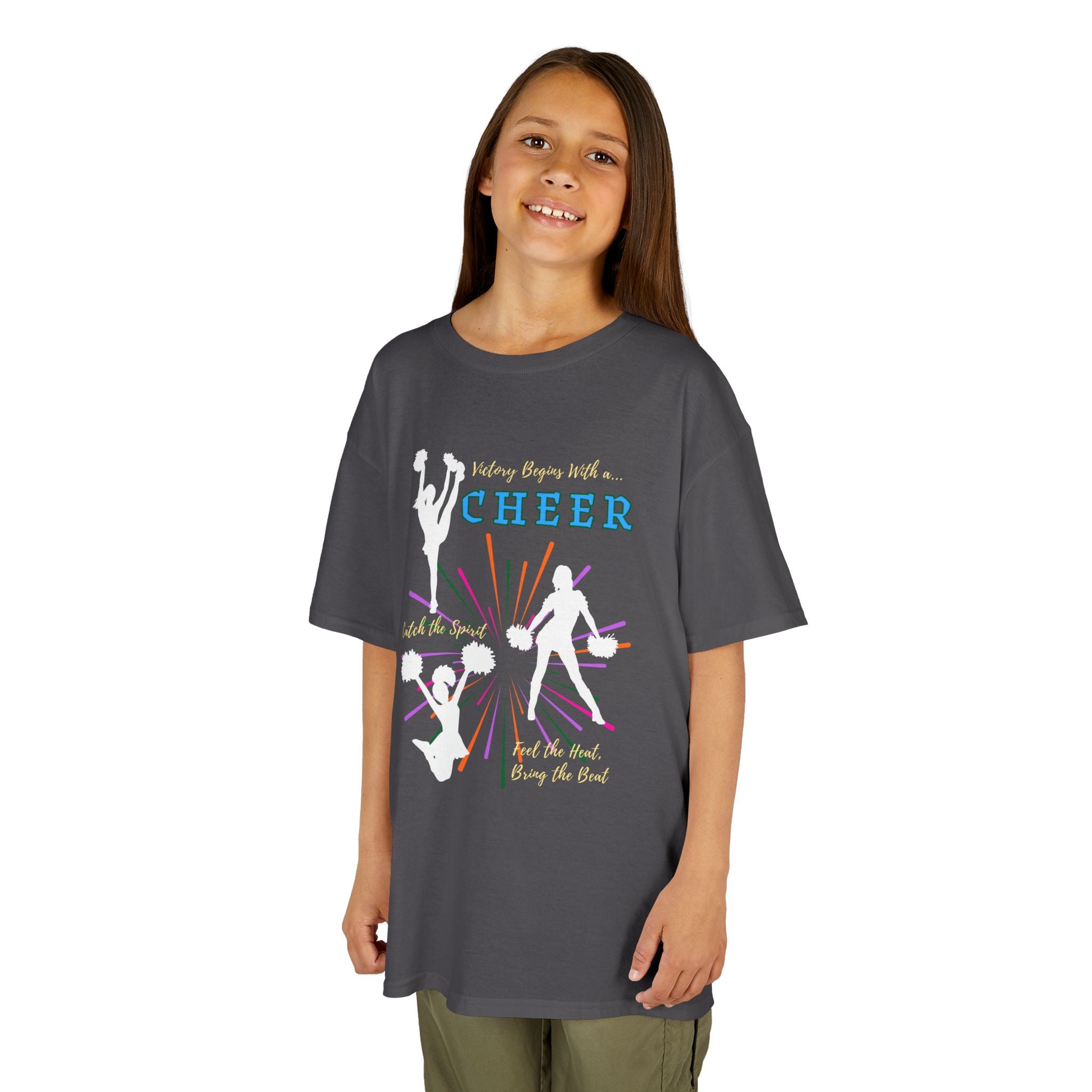 Young girl wearing a youth Gildan 5000B heavy cotton t-shirt in charcoal with a Cheer Team design