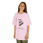 Young girl wearing a youth Gildan 5000B heavy cotton t-shirt in light pink featuring a girl Skateboarding