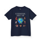 Front view of a youth Gildan 5000B heavy cotton t-shirt in navy with an International Dance Day theme 