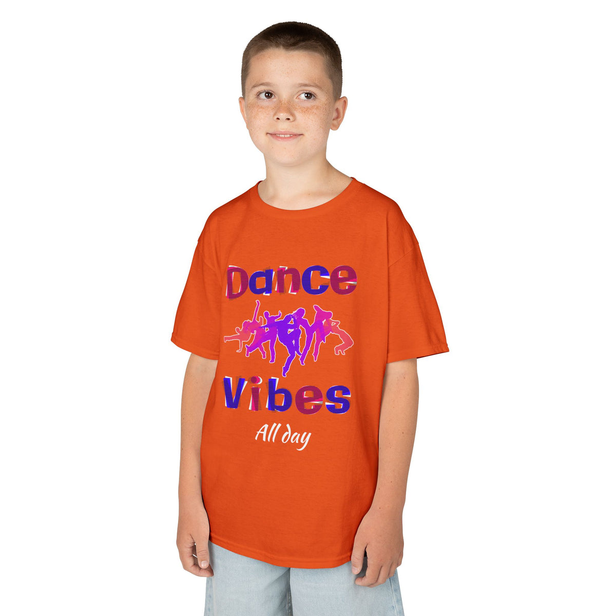 Young boy wearing a youth Gildan 5000B heavy cotton t-shirt in orange with a Dance Vibes All Day text and graphic