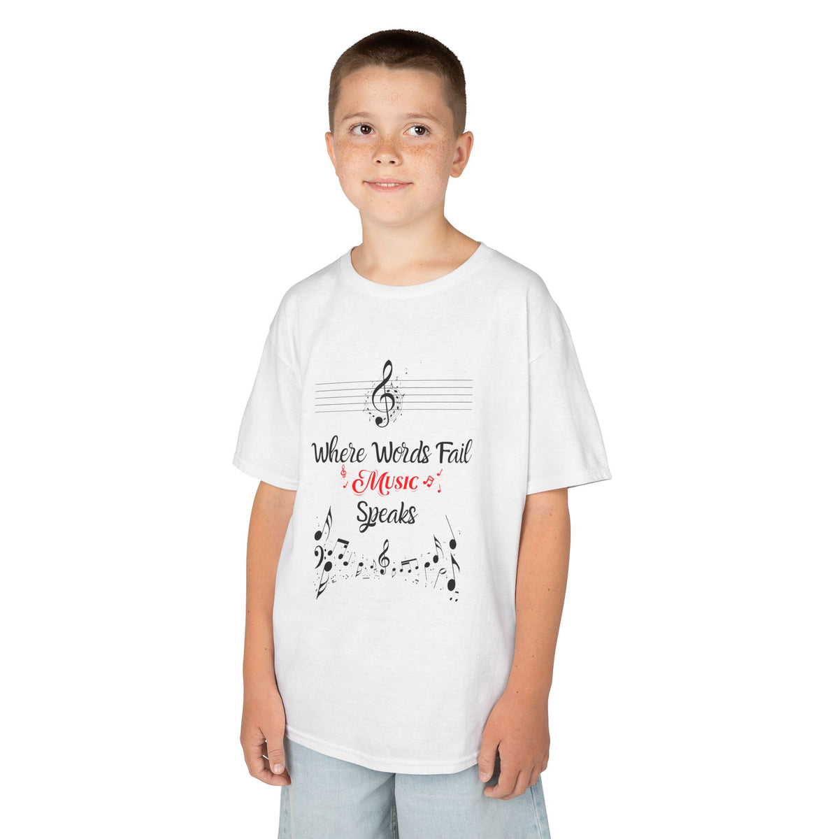 Young boy wearing a youth Gildan 5000B heavy cotton t-shirt in white with a Where Words Fail Music Speaks text and graphic