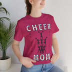 A woman wearing a berry graphic t-shirt with CHEER GO TEAM MOM text and graphic on the front.