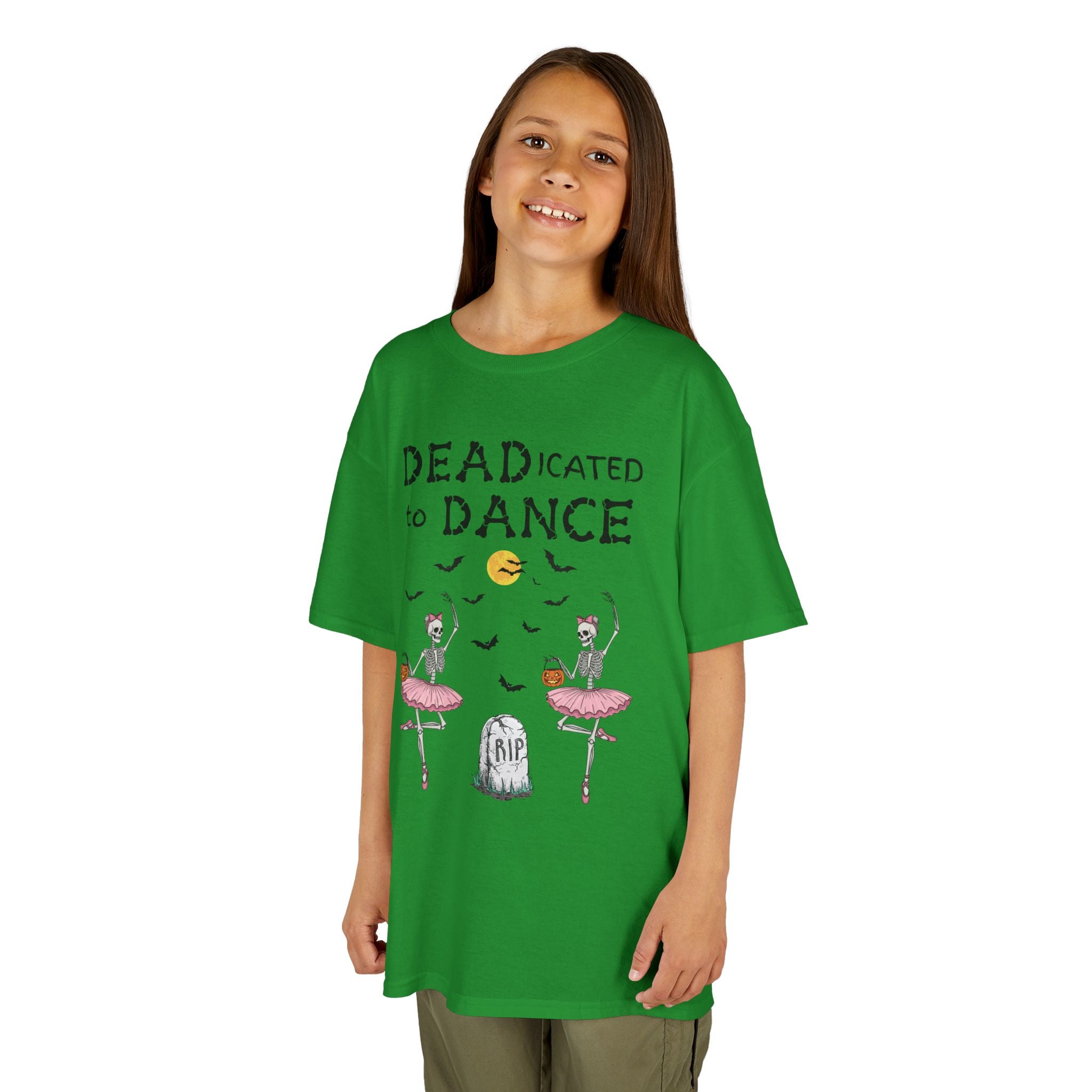 Young girl wearing a youth Gildan 5000B heavy cotton t-shirt in irish green with a Deadicated to Dance Halloween theme