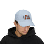 Man wearing a light blue embroidered classic dad cap hat with Play Ball text and basketball graphic 