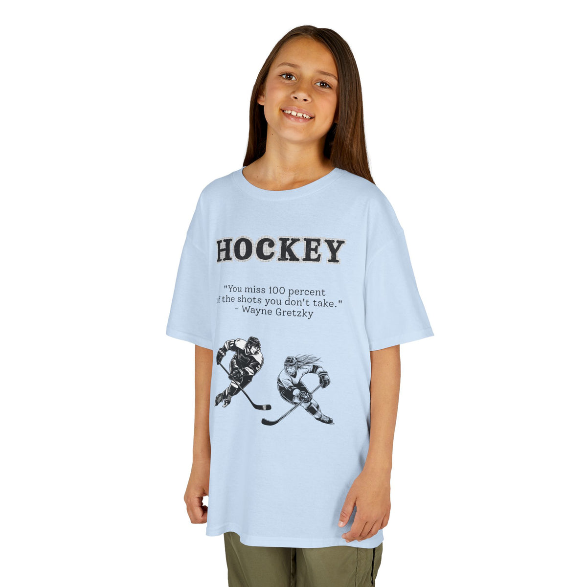 Young girl wearing a youth Gildan 5000B heavy cotton t-shirt in light blue with a Hockey text and graphic