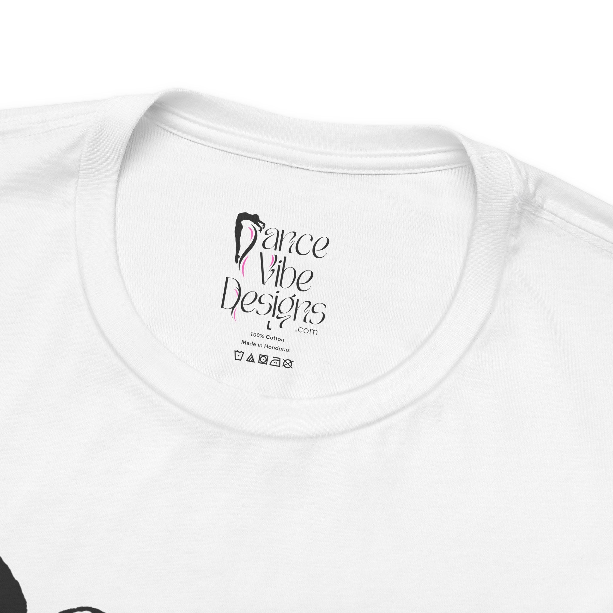 Close-up of a crewneck t-shirt showing the inner neck label with the brand Dance Vibe Designs printed above the care instructions.