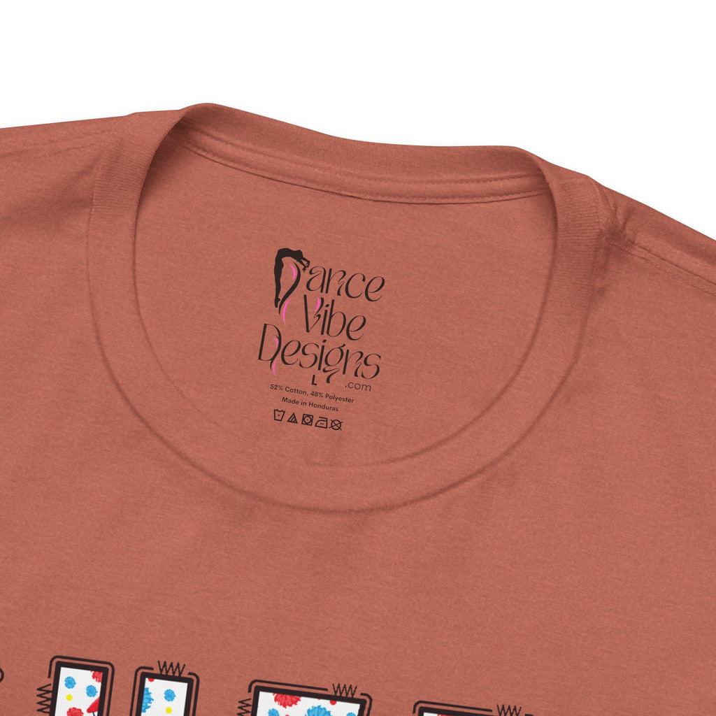 Close-up of a t-shirt's inner neck label with the brand Dance Vibe Designs printed above the care instructions.