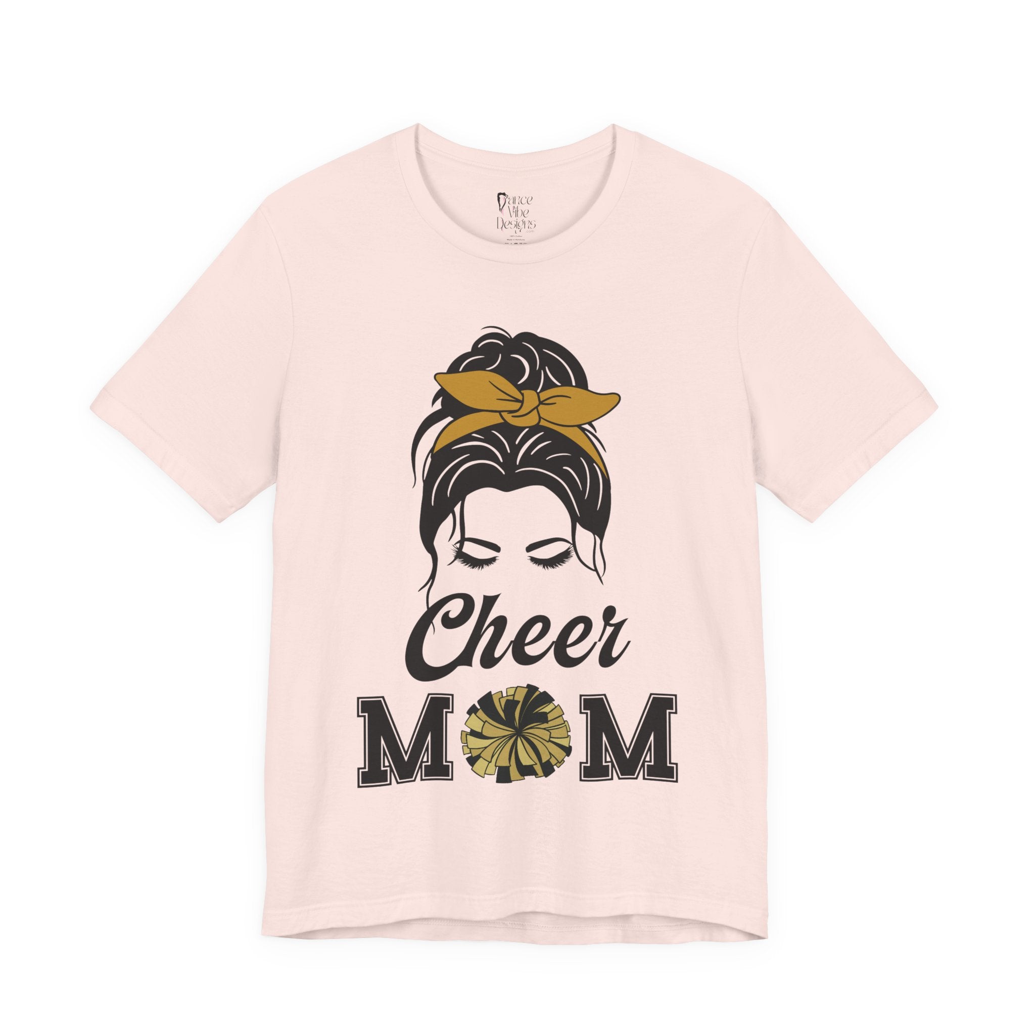 A soft pink short-sleeve crewneck t-shirt featuring a Cheer Mom silhouette graphic print with text.