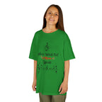 Young girl wearing a youth Gildan 5000B heavy cotton t-shirt in irish green with a Where Words Fail Music Speaks text and graphic
