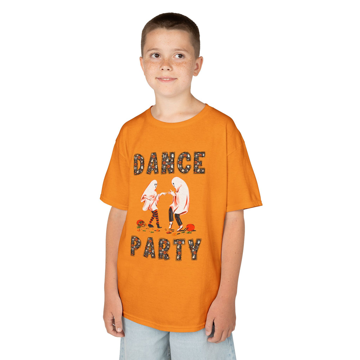 Young boy wearing a youth Gildan 5000B heavy cotton t-shirt in tennessee orange with a Halloween Dance Party theme