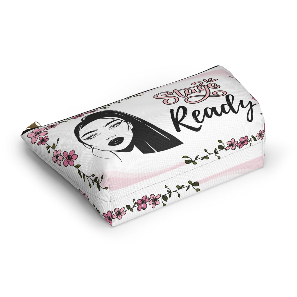 Makeup bag with face and floral design on a white background bottom view