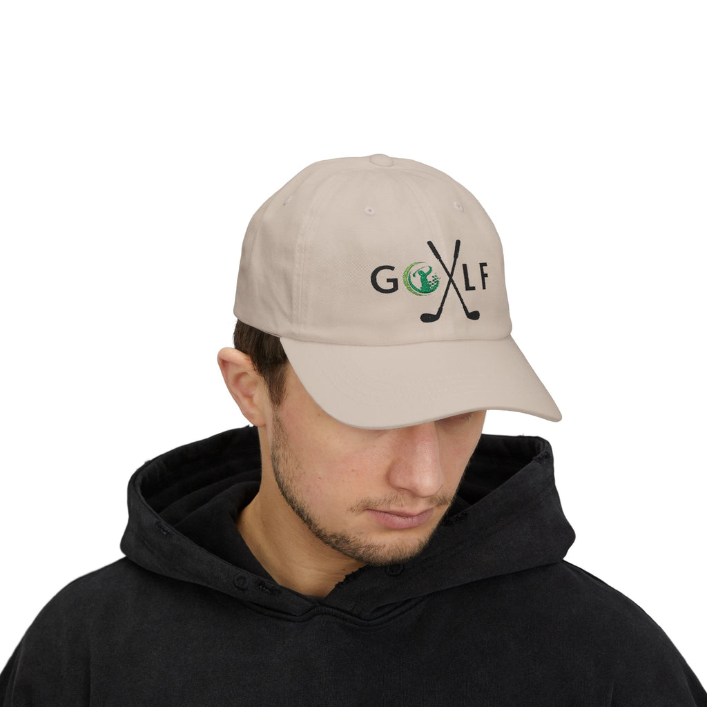 Man wearing a stone embroidered classic dad cap hat with a Golf text and graphic