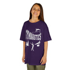 Young girl wearing a youth Gildan 5000B heavy cotton t-shirt in purple with a gymnastics text and graphic