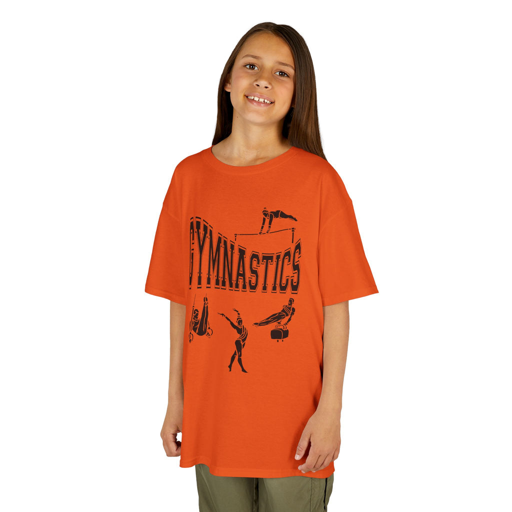 Young girl wearing a youth Gildan 5000B heavy cotton t-shirt in orange with a gymnastics text and graphic