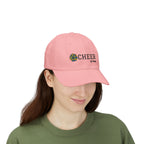 Woman wearing a pink embroidered classic dad cap hat with a Cheer text and graphic