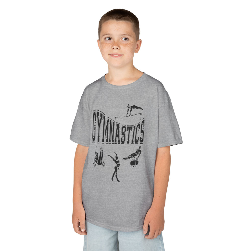 Young boy wearing a youth Gildan 5000B heavy cotton t-shirt in sport grey with a gymnastics text and graphic