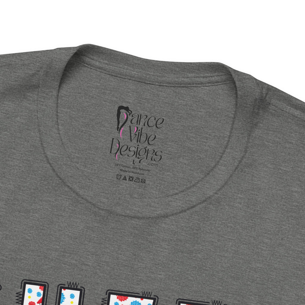 Close-up of a t-shirt's inner neck label with the brand Dance Vibe Designs printed above the care instructions.
